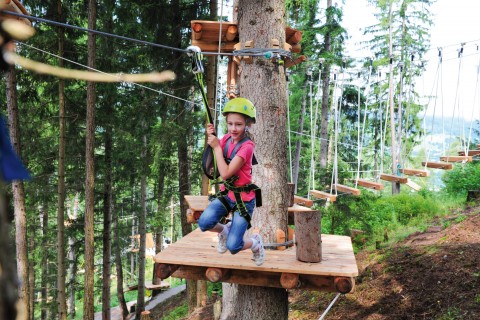 Zip-Line in the high rope course of the XP adventure park